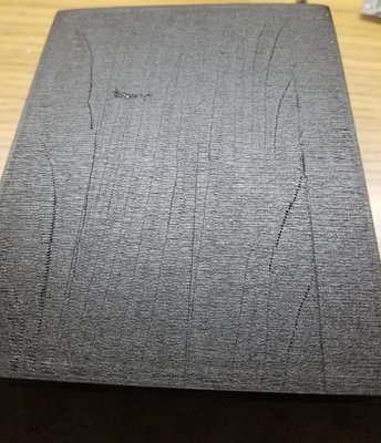 Underside of that little raised issue.  Usually the second layer flattens this to the point it isn't visible but I've been using 30C printbed to help print removal and reduce elephant foot.  xaxis offset didn't help there.